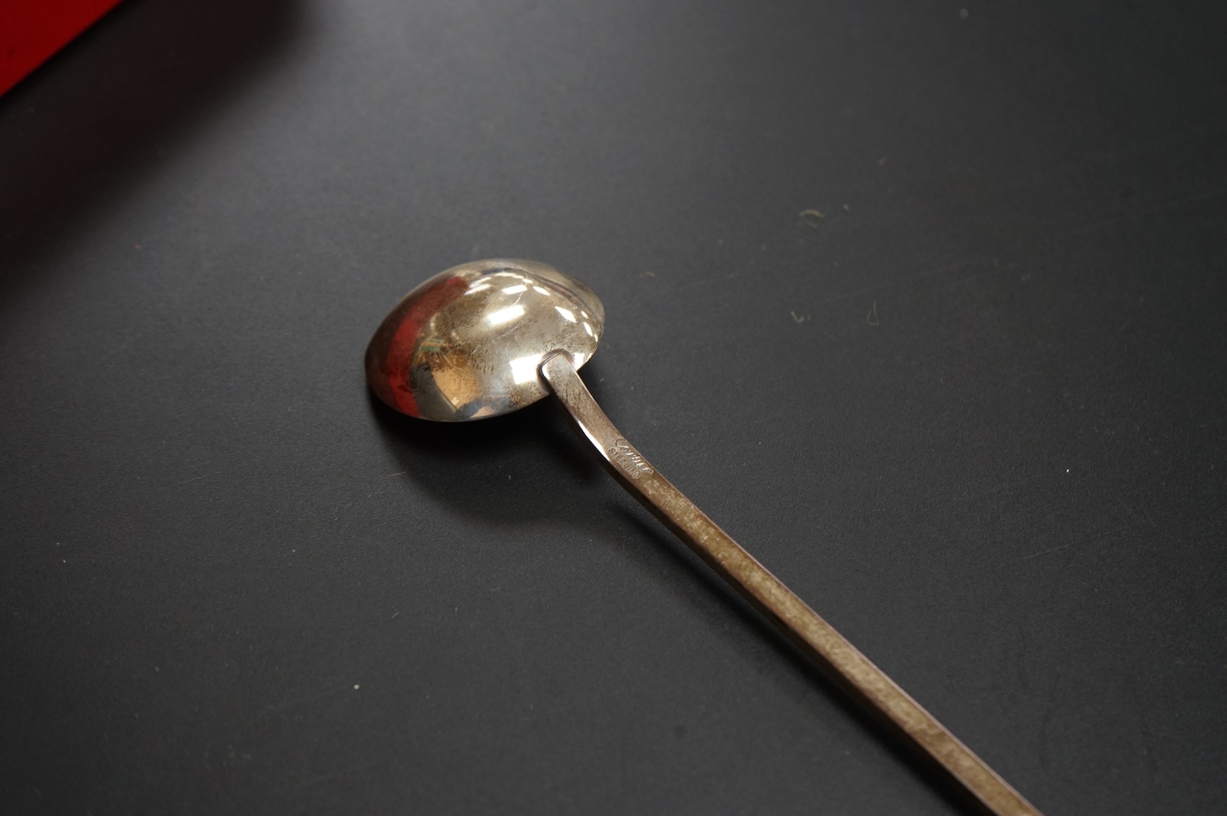 A late 20th century Cartier sterling cocktail stirring spoon, 22.7cm, 33 grams, with Cartier pouch and box.